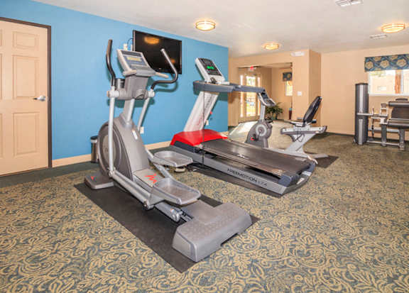 a gym with exercise equipment in a hotel room at Desert Bay Apartments, Laughlin, NV
