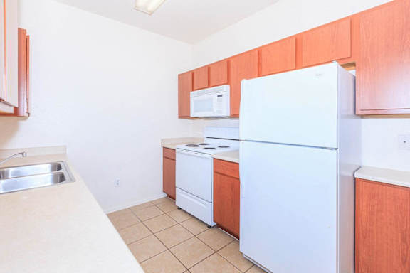 Kitchen with Cabinets at San Martin Apartments, Glendale, Arizona