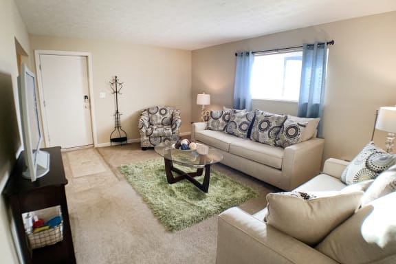 Couch and center table at Oakwood Apartments, Florence, KY, 41042