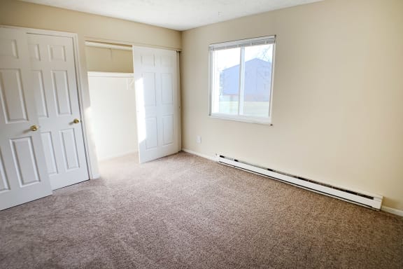 Cupboard and window view in bedroom at Oakwood Apartments, Florence