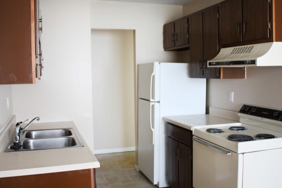 Wooden cabinets, ceiling light and appliances at Sharondale Woods Apartments, Ohio, 45241
