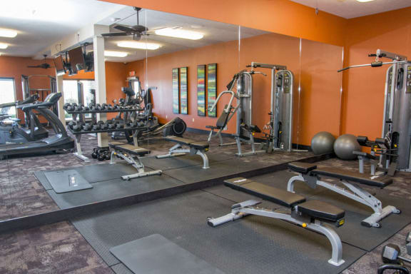 Clubhouse at Flats at 84 fitness center machines and free weights