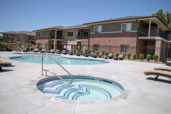 Resort style swimming pool and hot tub at The Villas of Omaha at Butler Ridge in Omaha, Nebraska