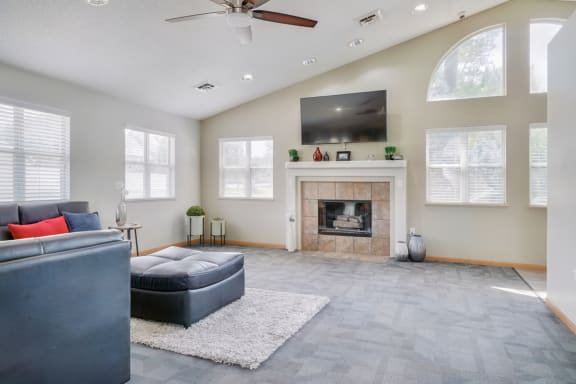 Great room with fireplace, mounted TV, and sectional sofa