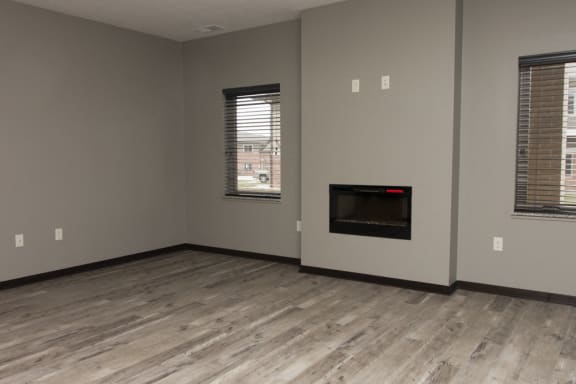 Living room area with electric fireplace at North Pointe Villas in north Lincoln, Nebraska
