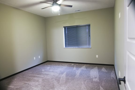 Bedroom including a ceiling fan at North Pointe Villas