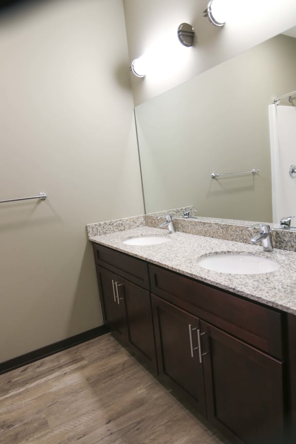 Master bathroom with shower and double sinks with granite countertops in 3 bedroom apartment for rent at North Pointe Villas best apartments Lincoln NE 68521
