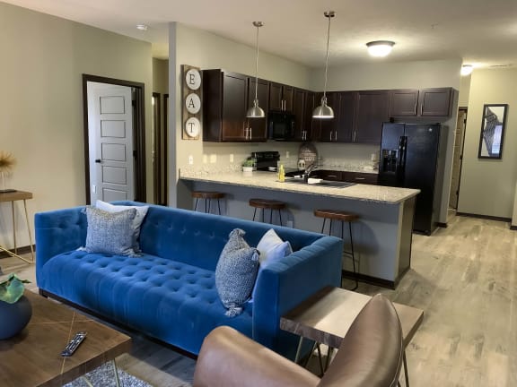 Kitchen and living area in a Harper three bedroom floor plan apartment at North Point Villas in Lincoln Ne