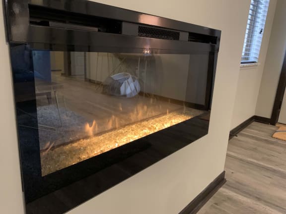 The Harper three bedroom floor plan features a modern electric fireplace