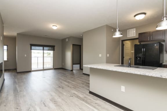 Spacious dining and living area with hardwood floors at North Pointe Villas in north Lincoln, Nebraska