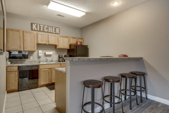 Full kitchen in the clubhouse with bar seating at Northridge Heights in north Lincoln, Nebraska 68504