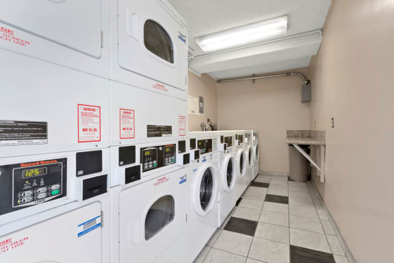 a laundry room with washers and dryers at Parkview Terrace Apartments, Sherman Oaks, CA