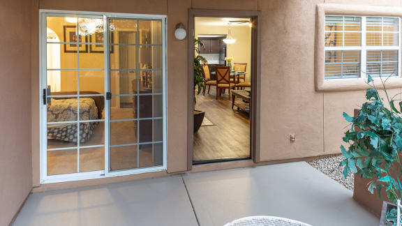 La Reserve patio with glass doors and lounge area