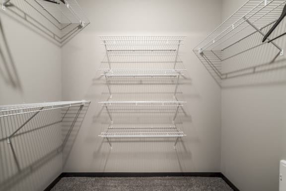 Huge walk-in closet with plenty of shelving  and hanging space at The Villas at Falling Waters in Omaha, NE