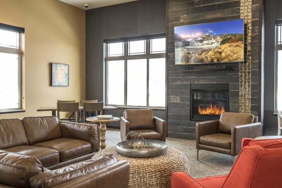 Comfortable seating and television viewing area at 360 at Jordan West in West Des Moines, IA