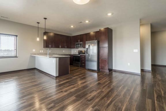 Open floor plan living room and kitchen at 360 at Jordan West