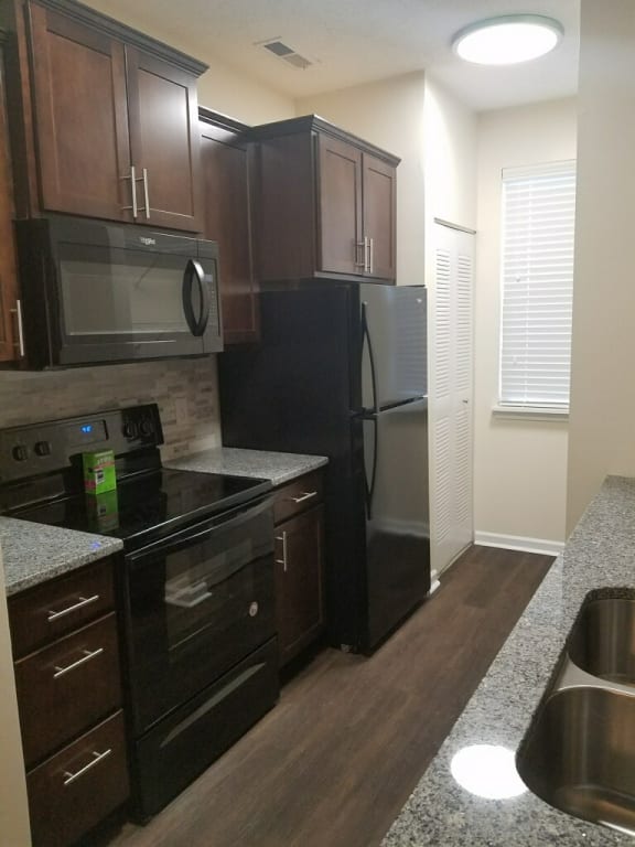 Black Appliances at Sand Creek Woods Apartments, Fishers