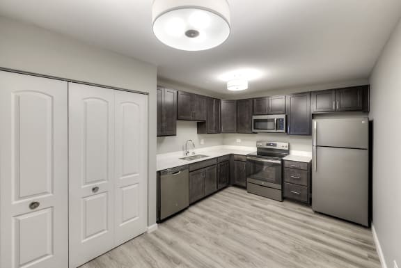 Modern lighting in kitchen - Eagle Creek Apartments