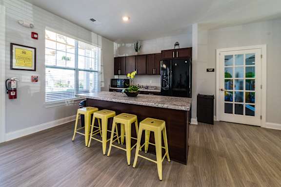 Kitchen with a bar stool  at The Assembly Apartments, Greenville, SC
