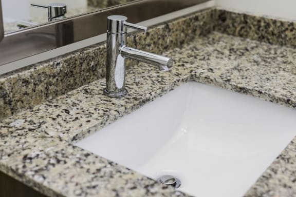 Granite vanities in bath at Courthouse Square Apartments, Wheaton