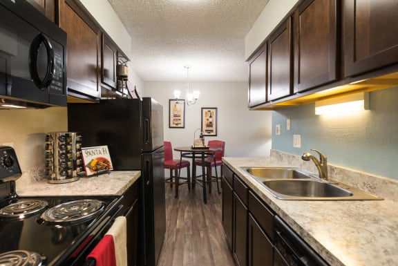 Kitchen island and cabinets at Park 88 Apartments, Thornton, CO