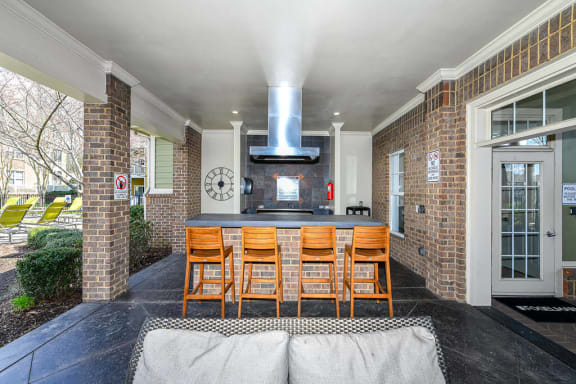 Outdoor Entertainment Space with Gas Grill and Bar Height Seating and Amble Counterspace at Alden Place at South Square Apartments, Durham, NC 27707