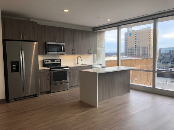 Kitchen area with cabinets at The Grand, Kansas City