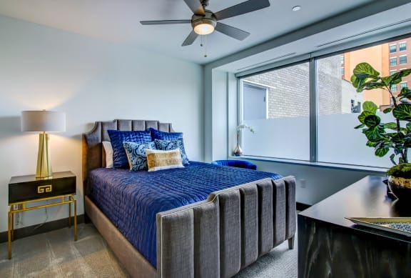 Bedroom with cozy bed at The Grand, Kansas City