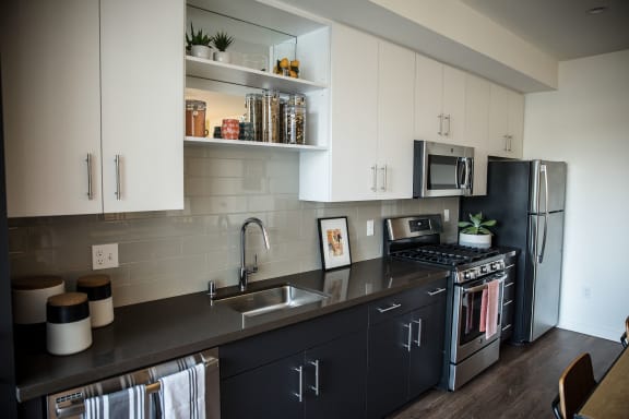 Stone Countertops, Tile Backsplashes, and Modern European-Style Cabinets at Imperial Hardware Lofts, California