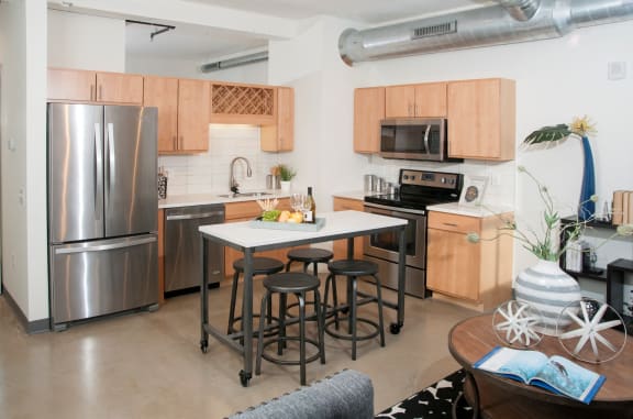 Fully Equipped Kitchens And Dining at 700 Central Apartments, MN, 55414