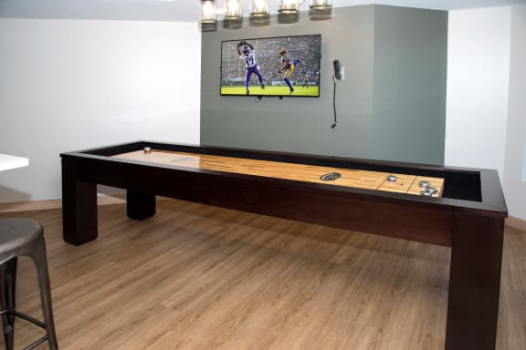 Gaming Area with Shuffleboard table at Aspenwoods Apartments, Eagan