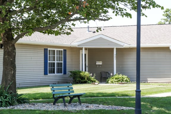 bench and trees near apartment