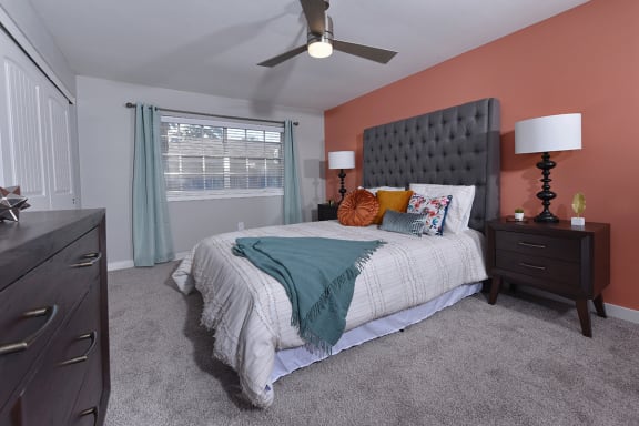 Bedroom in Watermarc luxury apartment in lakeland, fl with plush carpet and ceiling fan