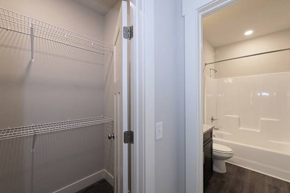 A white door is open to a bathroom at McHenry Square Apartments, Georgia, 30909