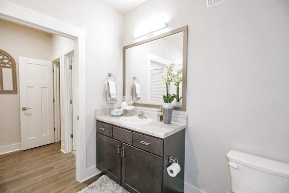 A bathroom with a white sink and a mirror above it at McHenry Square Apartments, Augusta, GA, 30909