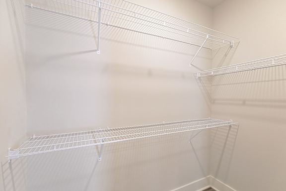 Empty white shelves in a pantry. at McHenry Square Apartments, Augusta