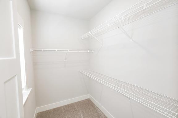 Empty white walk in closet with shelves at McHenry Square Apartments, Augusta, GA