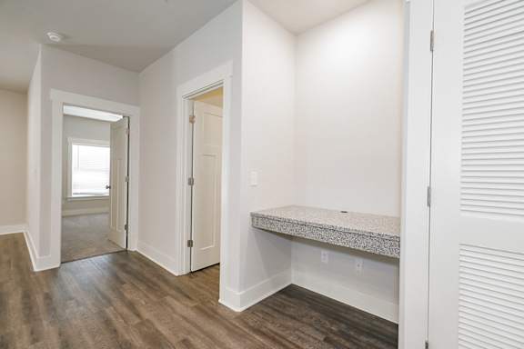 A room with a bench and a door at McHenry Square Apartments, Augusta