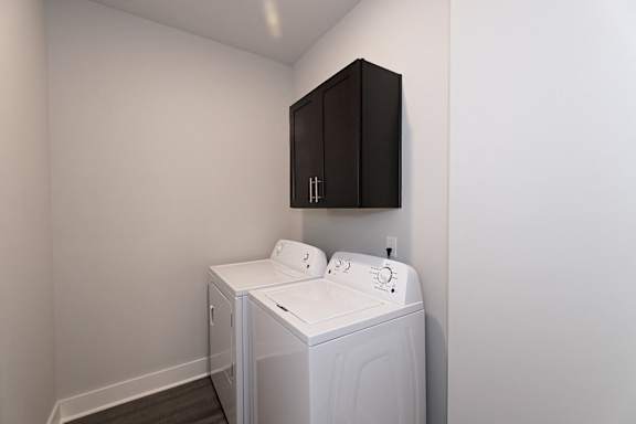 A washing machine sits in a small room at McHenry Square Apartments, Augusta, GA
