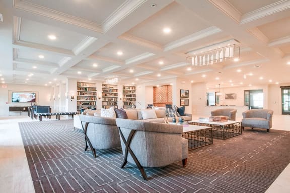 Spacious Lobby Area With Library at Village Center Apartments At Wormans Mill*, Frederick, Maryland