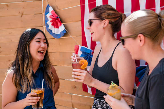 Girls having drink and laughing at Azul Baldwin Park, Orlando, Florida