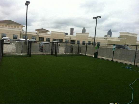 A green lawn in front of a building. at West Inman Lofts Apartments, Atlanta, GA