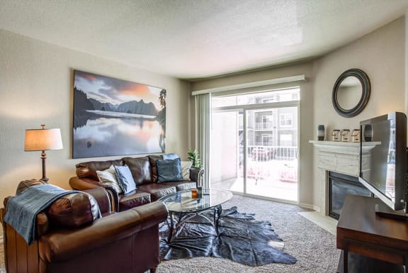 Living Room With Balcony View at The Preserve at Rock Springs, Rock Springs, WY