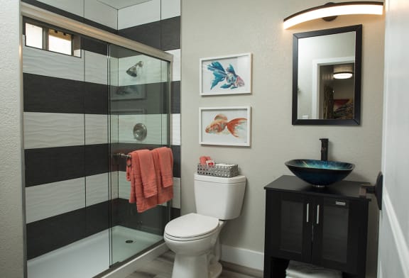 bathroom in fusion 1-bedroom apartment in Las Vegas, nv, with custom shower tile and basin sink.