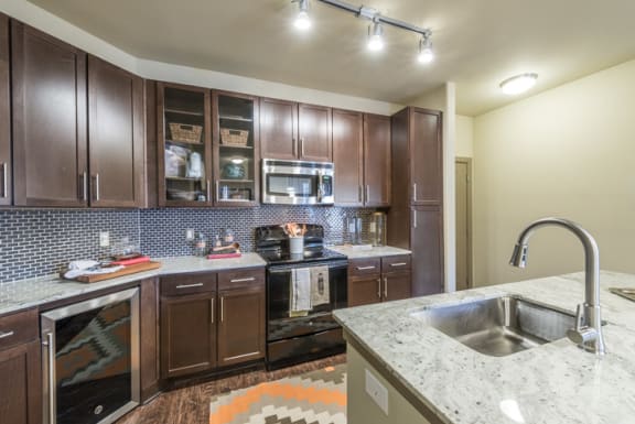 Fully Equipped Kitchen Includes Frost-Free Refrigerator, Electric Range, &amp; Dishwasher at Aviator West 7th, Texas, 76107