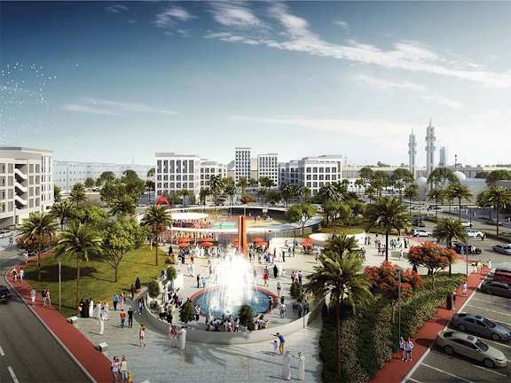 A city park with a fountain and palm trees.