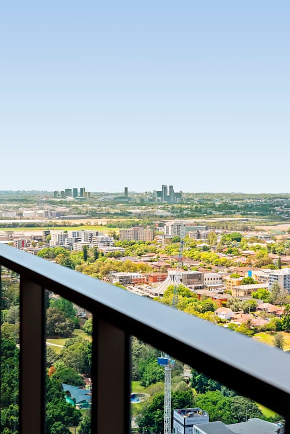 A cityscape viewed from a balcony.