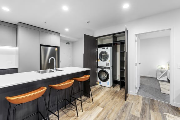 a kitchen with a counter top and a washing machine