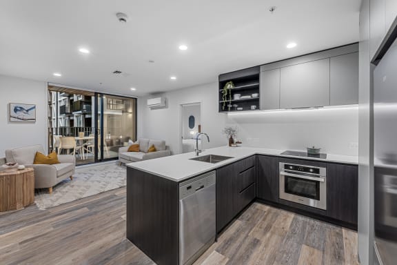 a kitchen with a sink and a counter top in a house