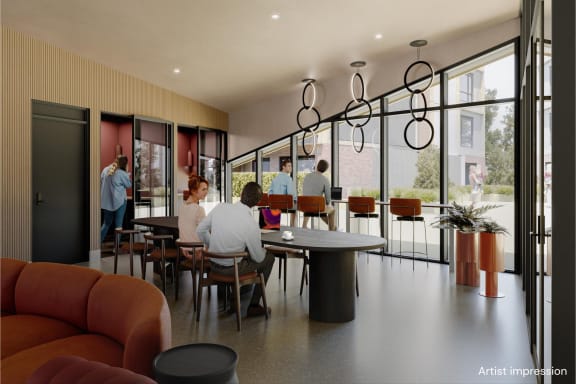 a rendering of people sitting at a table in a lobby